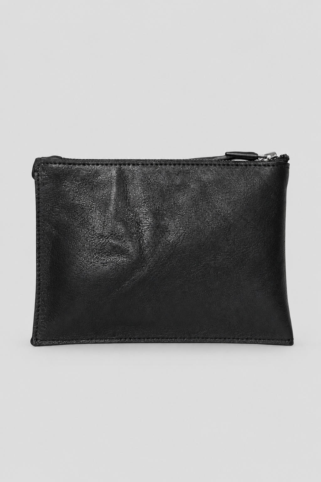 NUTSA NM9903 Leather Pouch in black calf leather with YKK zipper closure, fixed leather handle, and hand finished metal hardware