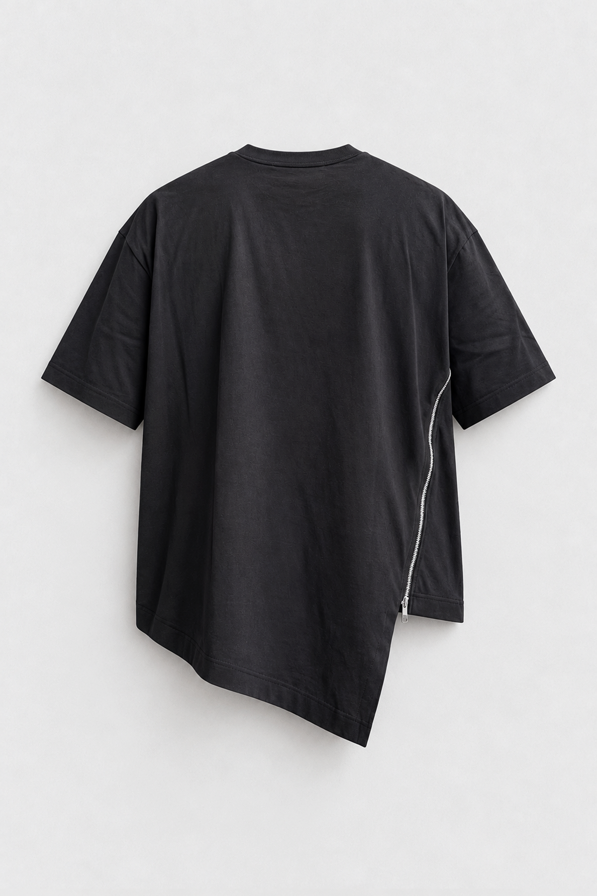 Comme des Garçons Shirt Black Zip Tee in black cotton with short sleeves, asymmetric hem, and curved side zip detail