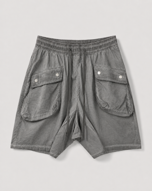 DESU Oversized Utility Shorts in grey lightweight cotton with oversized cargo pockets, elastic waistband, and drawstring detail
