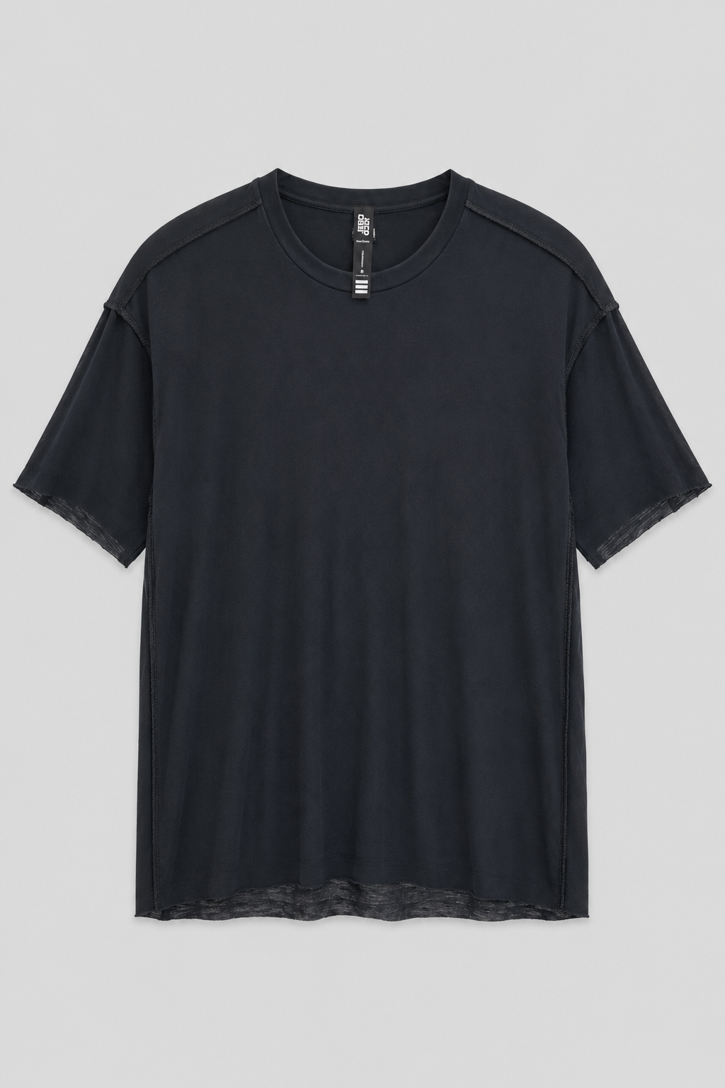 Desu Reversible T Shirt in black with exposed seam construction, crew neckline, and raw hem detail.