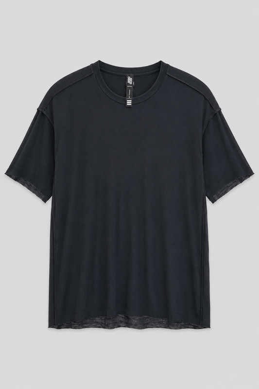 Desu Reversible T Shirt in black with exposed seam construction, crew neckline, and raw hem detail.