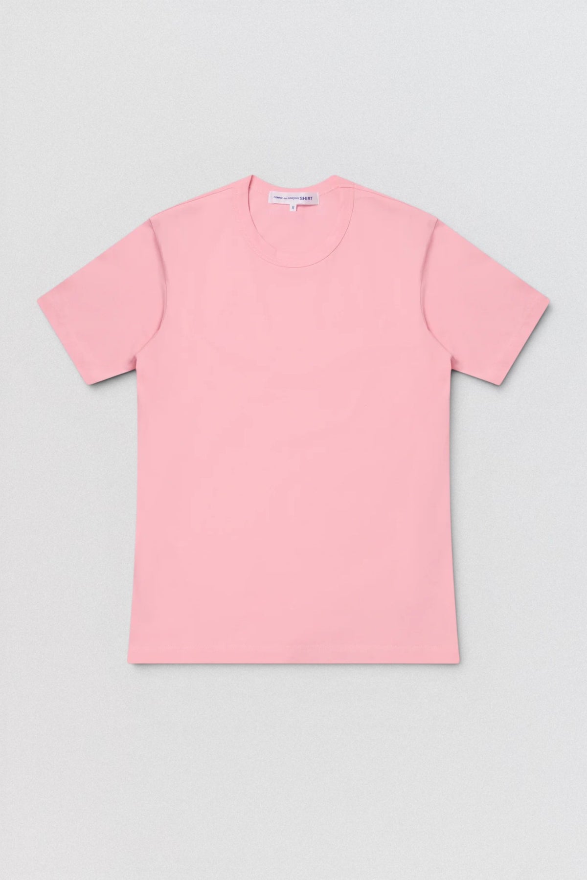 Pink t-shirt on a gray background