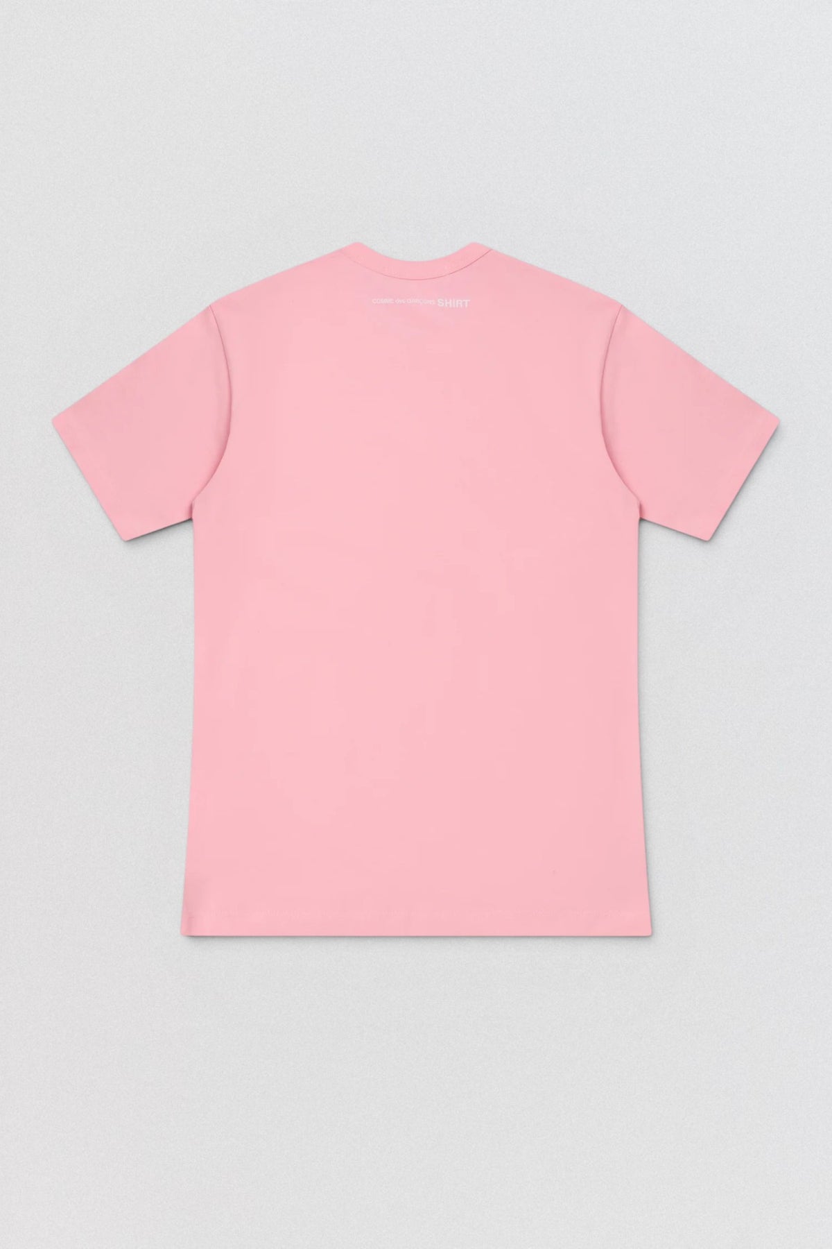 Pink t-shirt on a light gray background
