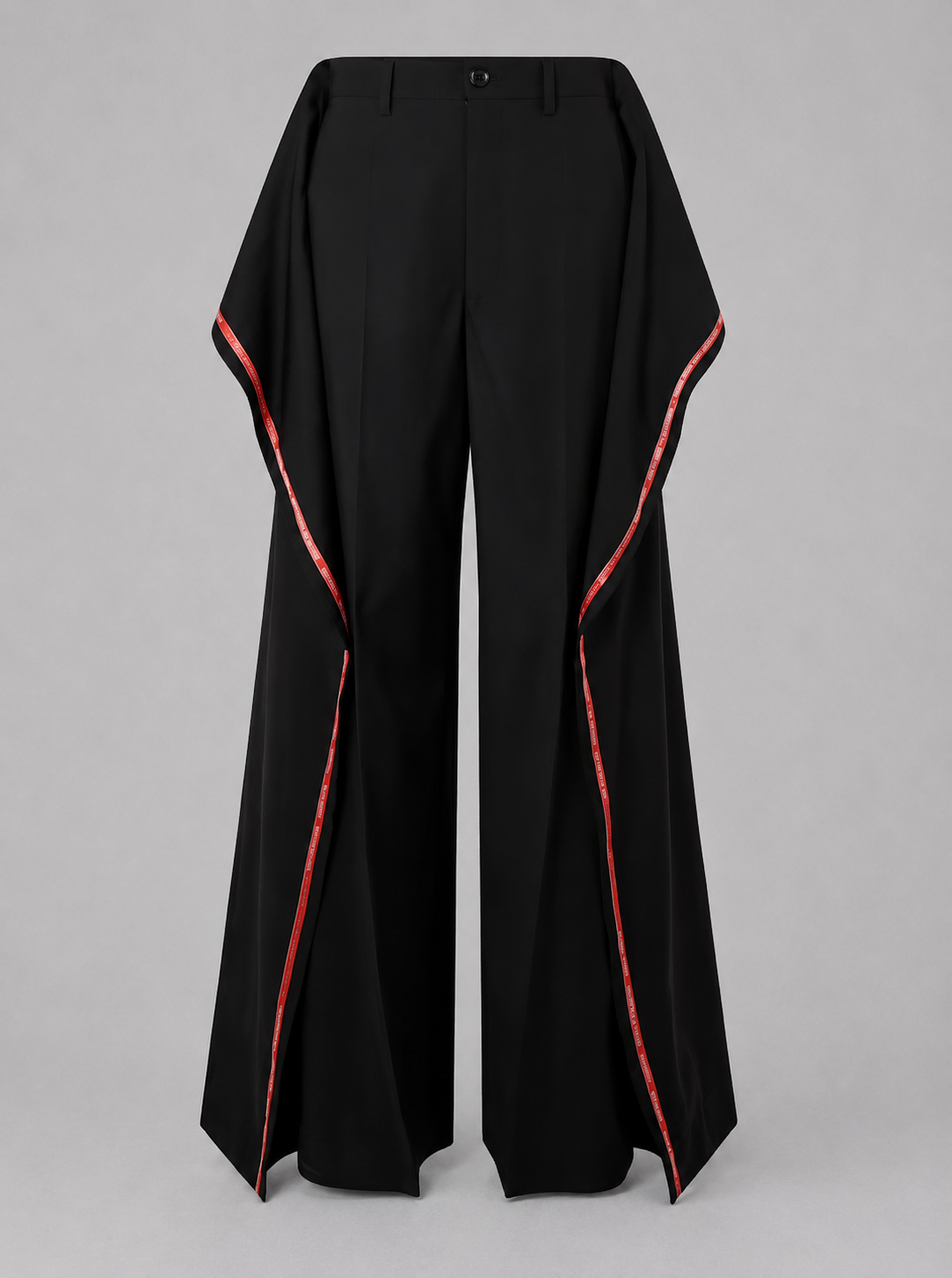Junya Watanabe SS26 Side Stripes Trousers. Black pants with red trim on a gray background