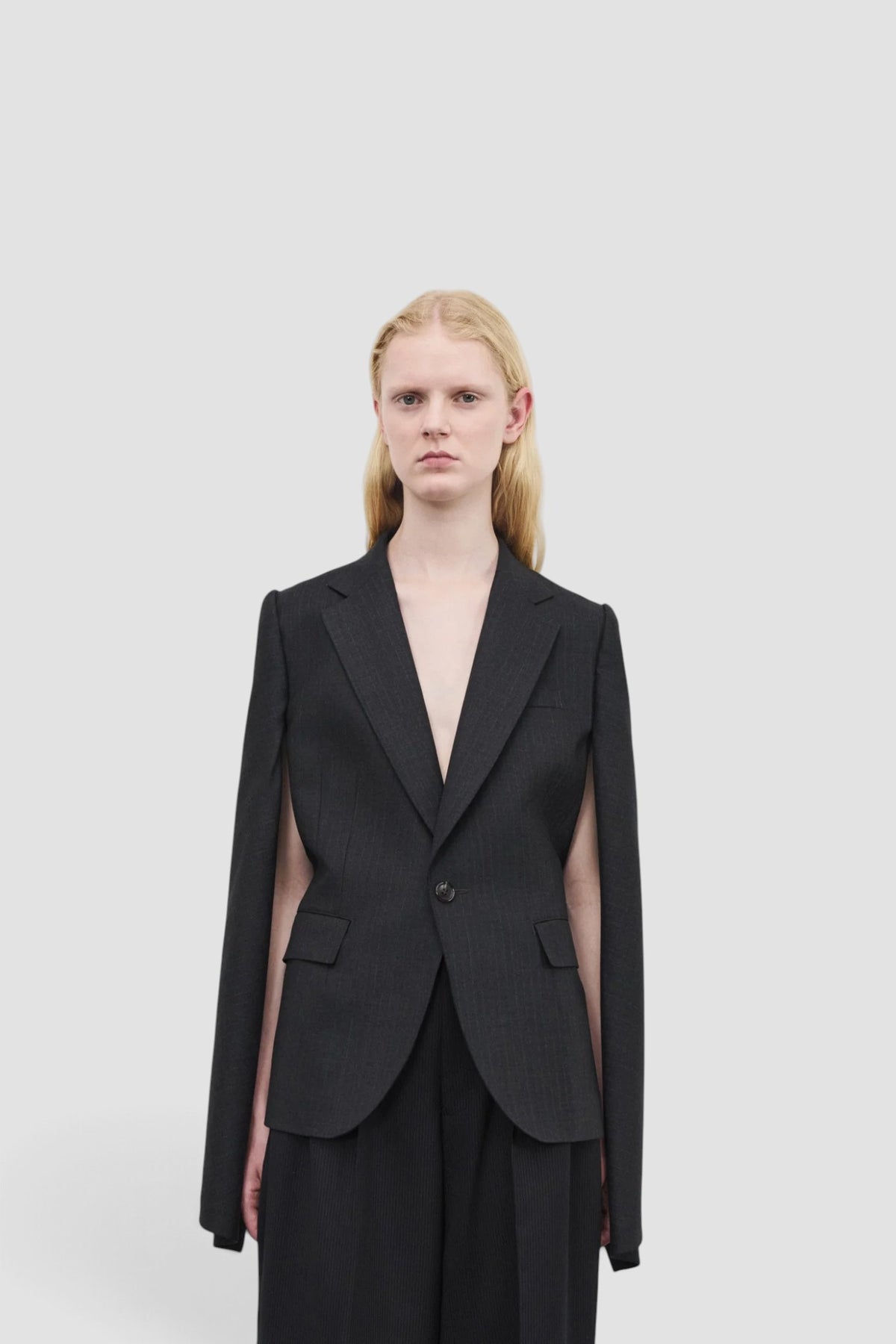 Women's Cut Out Sleeve Blazer in Charcoal Pin Stripe wool blend with tailored fit and asymmetric cut hem