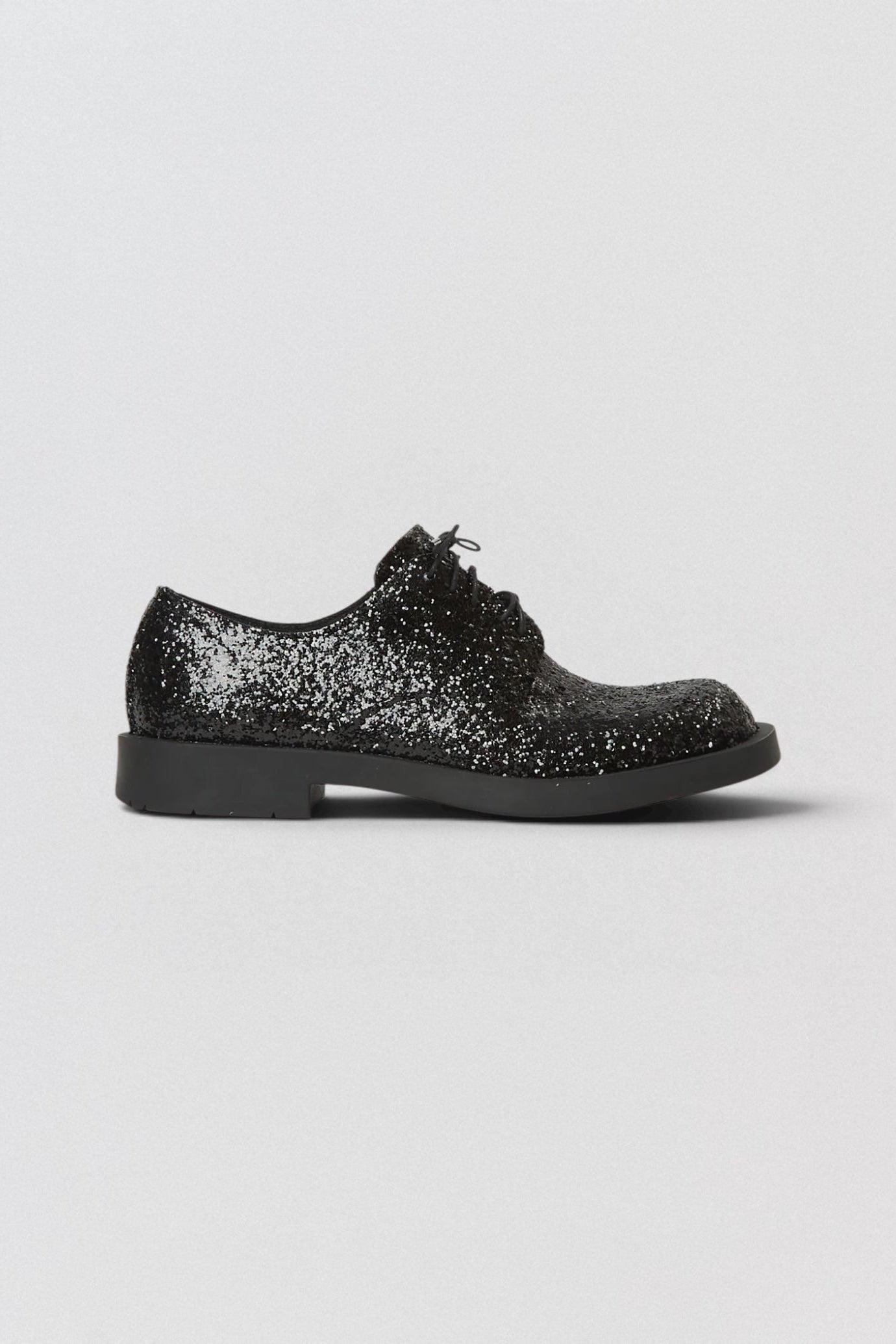Junya Watanabe x CamperLab MIL 1978 Derby Black glittery shoe on a light gray background