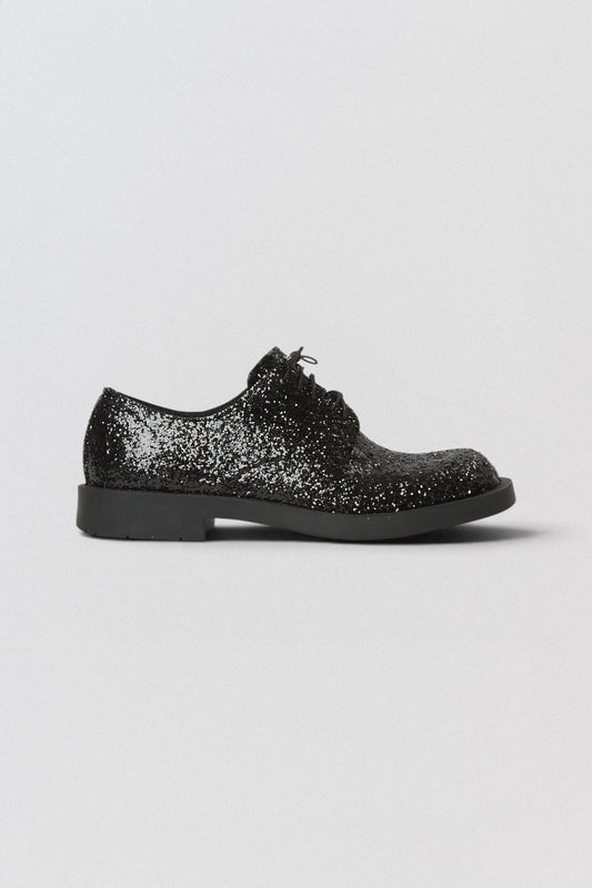Junya Watanabe x CamperLab MIL 1978 Derby Black glittery shoe on a light gray background