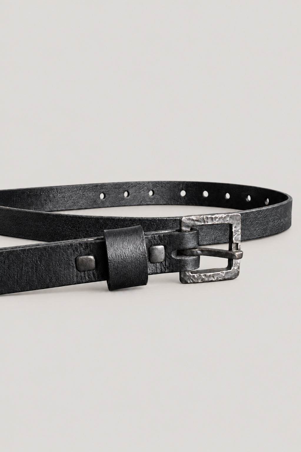 NUTSA NM06B Belt in black vegetable tanned calf leather with custom cast oxidized alpaca buckle.