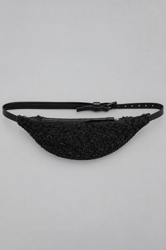 NUTSA NM1101B Belt Bag in black barracuda leather with curved pouch body, zipper closure, and adjustable leather strap