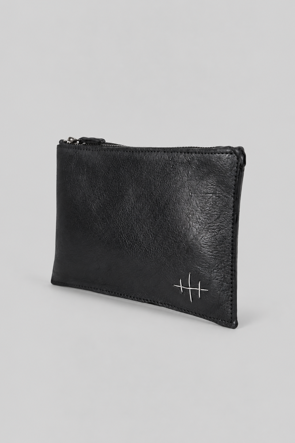 NUTSA NM9903 Leather Pouch in black calf leather with YKK zipper closure, fixed leather handle, and hand finished metal hardware