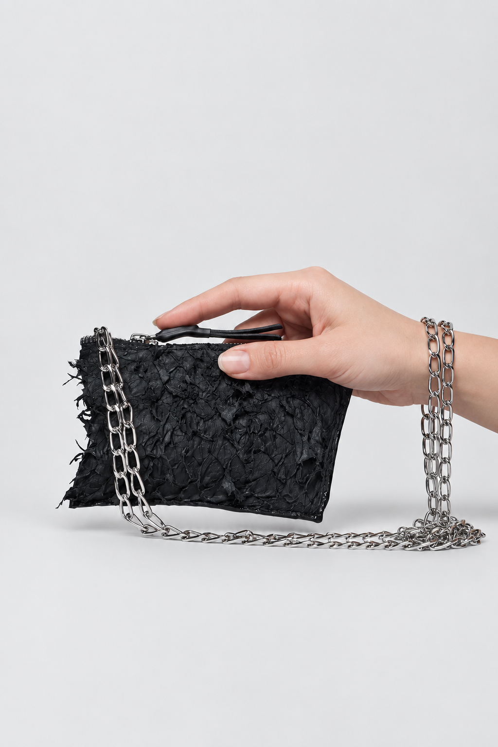 NUTSA NM9906 Leather Charm Pouch in black barracuda leather with detachable metal chain and YKK zipper closure