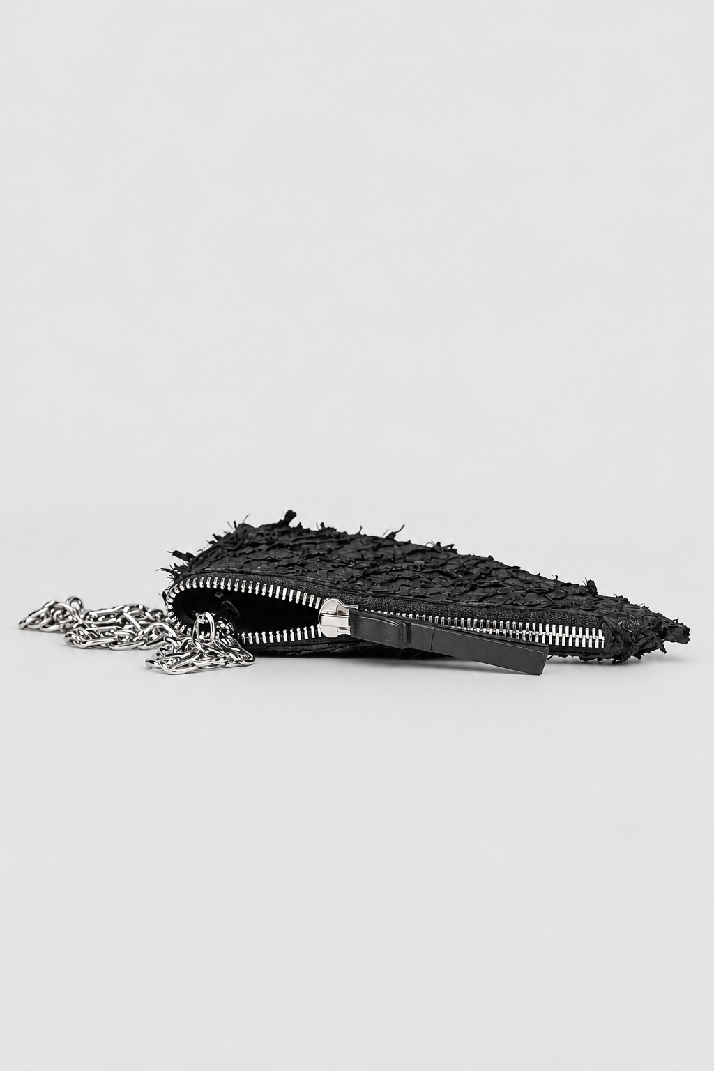 NUTSA NM9906 Leather Charm Pouch in black barracuda leather with detachable metal chain and YKK zipper closure