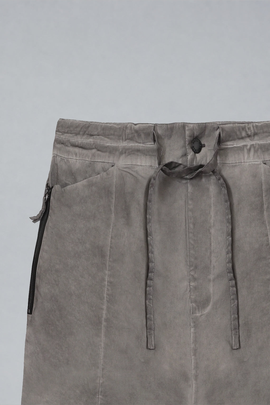 DESU Zipper Pocket Pants in grey cotton with drawstring belt, side zip pockets, and utility stitch detailing