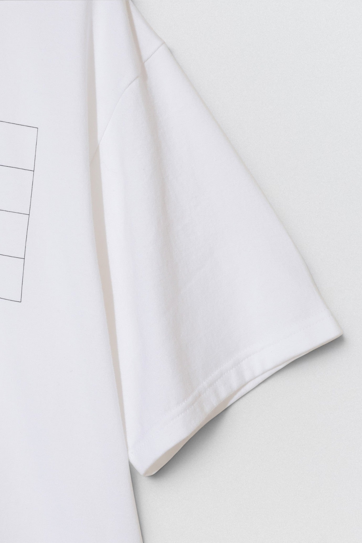 Undercover SS26 But Beautiful 4.5  White fabric with a subtle pattern on a light gray background