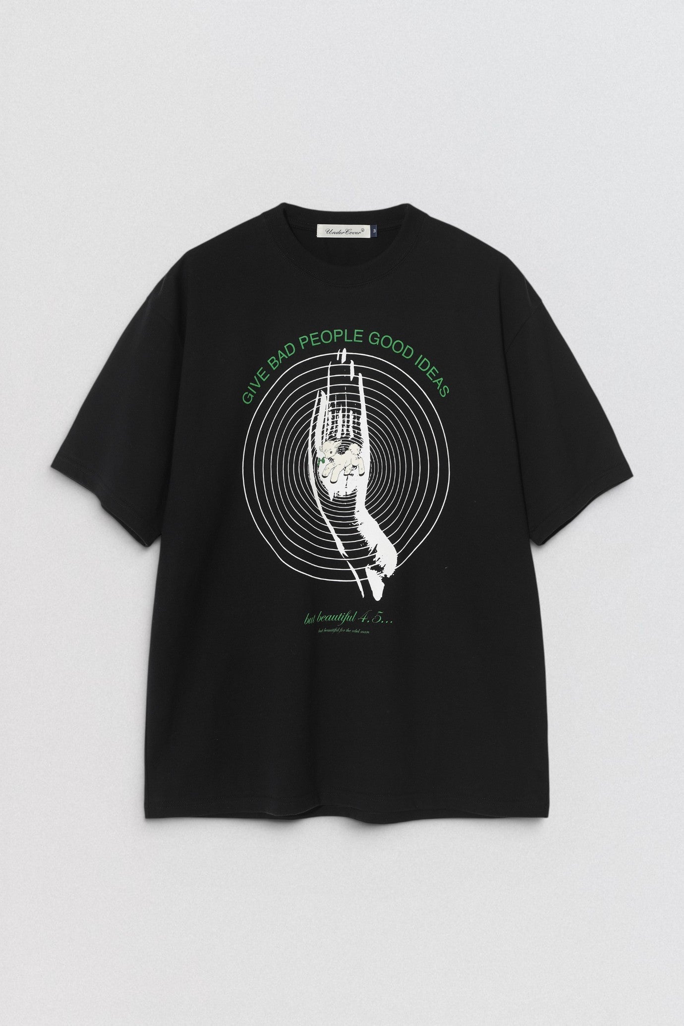 Undercover SS26 Give Bad People Good Ideas Black t-shirt with graphic design on a light gray background