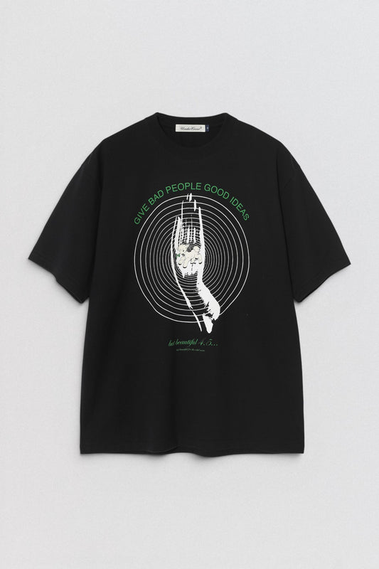 Undercover Give Bad People Good Ideas T Shirt in white with front graphic artwork