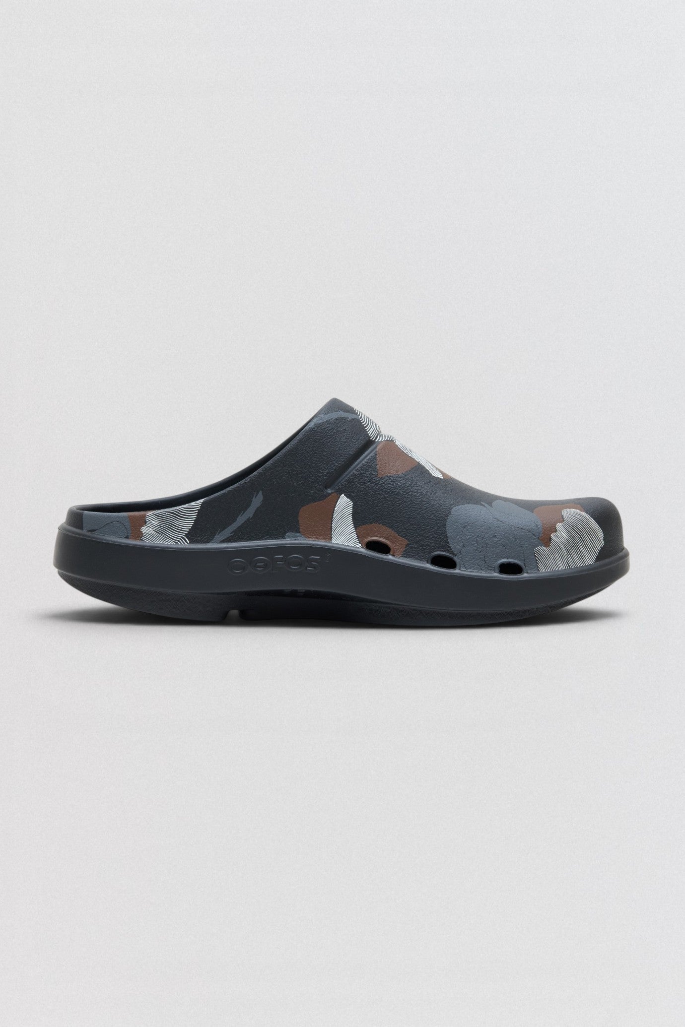 Undercover x OOFOS  Gray sandal with cartoon character design on a light gray background