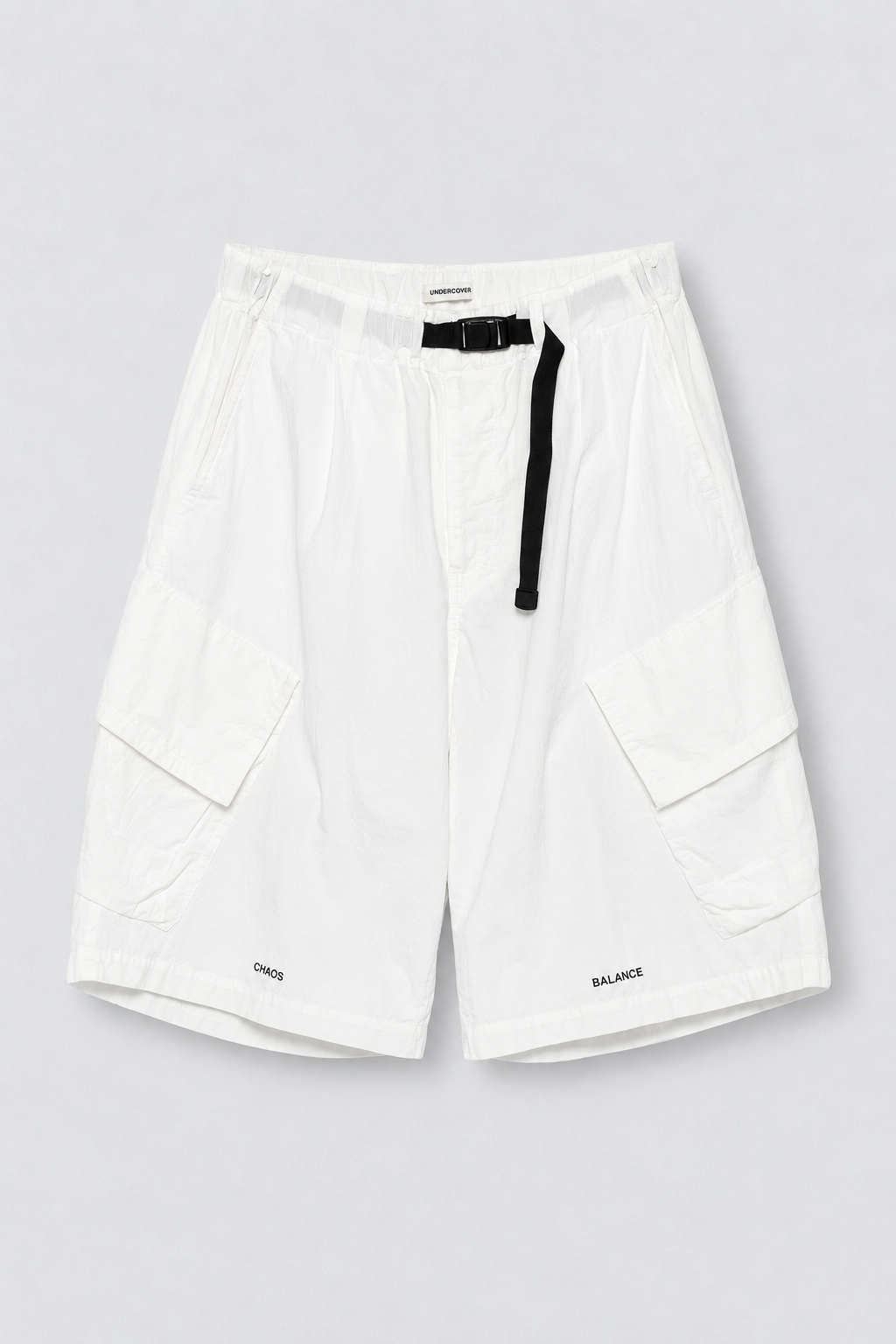 UNDERCOVER Belted Cargo Shorts in white cotton woven fabric with black built in belt, cargo pockets, and CHAOS BALANCE embroidery