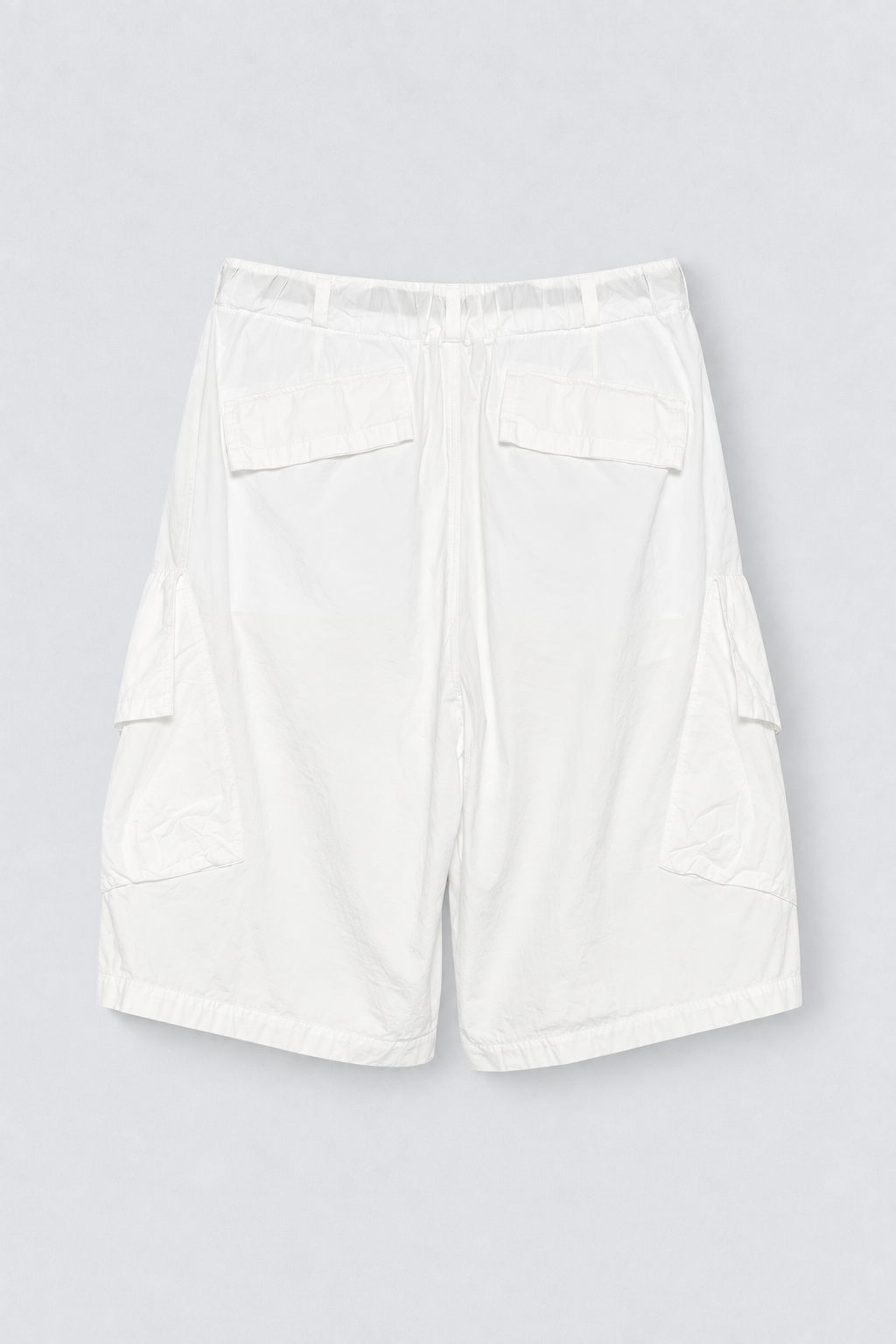 UNDERCOVER Belted Cargo Shorts in white cotton woven fabric with black built in belt, cargo pockets, and CHAOS BALANCE embroidery