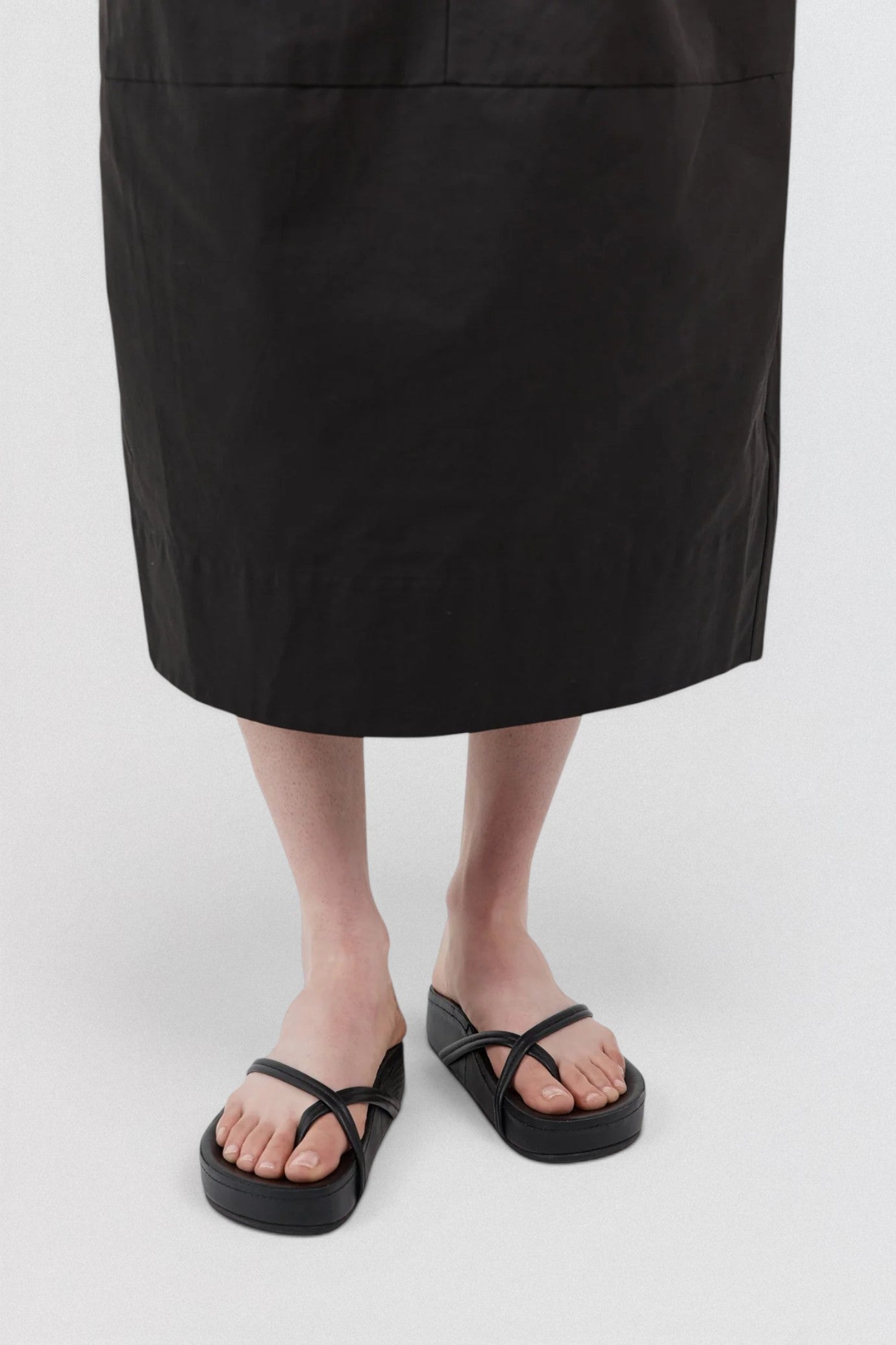 ST. AGNI Cross Strap Flatform in black with lambskin crossover straps and chunky flatform sole