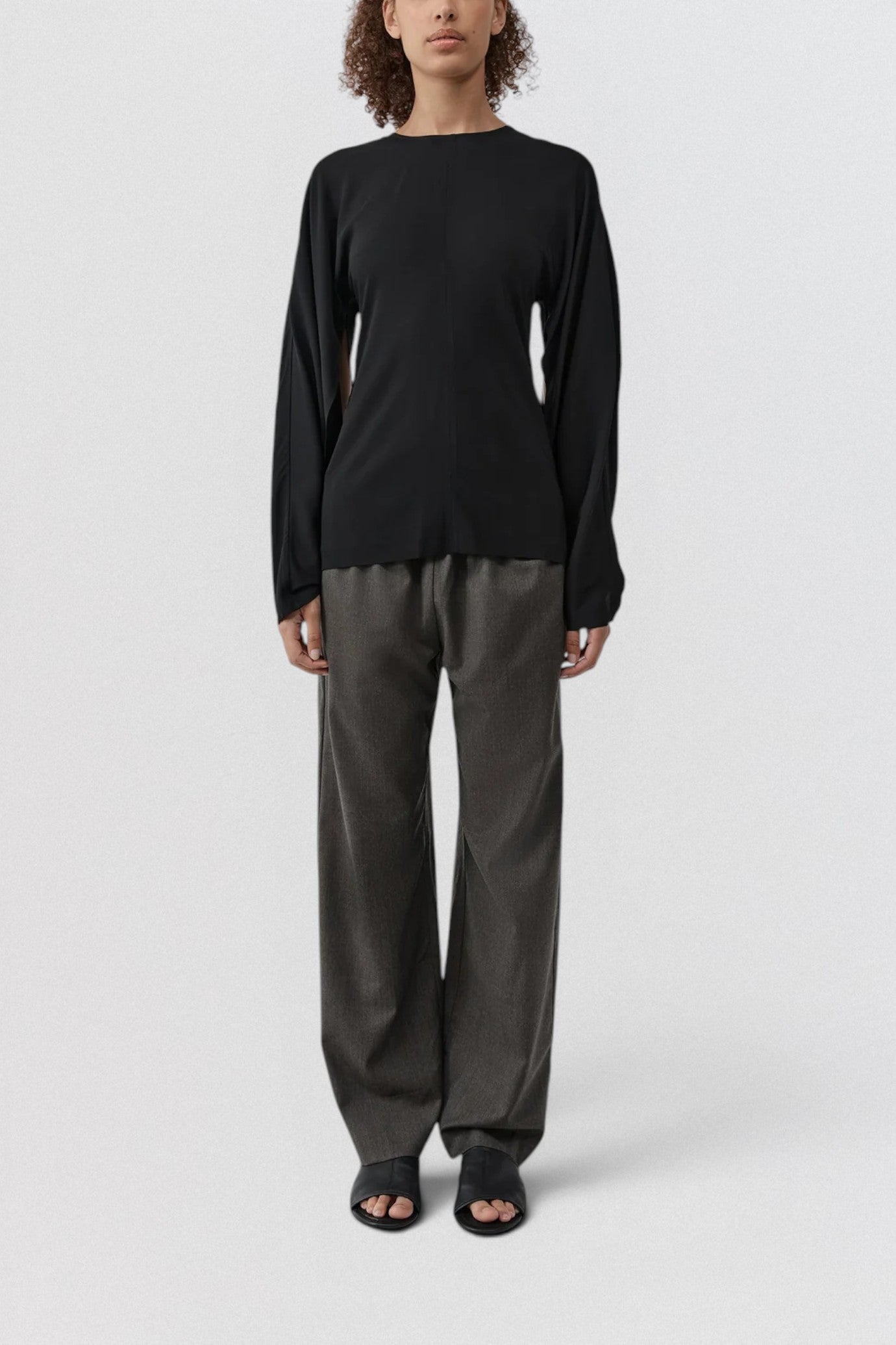 ST. AGNI Hybrid Top in black with multi-wear extended sleeves and fluid viscose construction