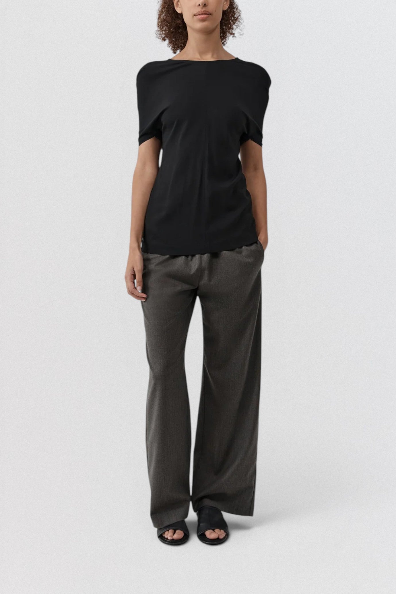 ST. AGNI Hybrid Top in black with multi-wear extended sleeves and fluid viscose construction