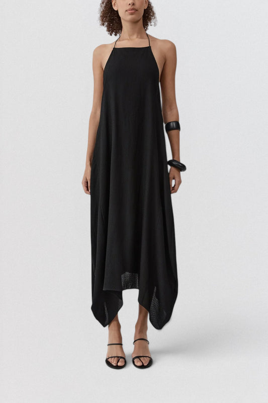 ST. AGNI Textured Weave Halter Dress in black with square halter neckline and asymmetric handkerchief hem