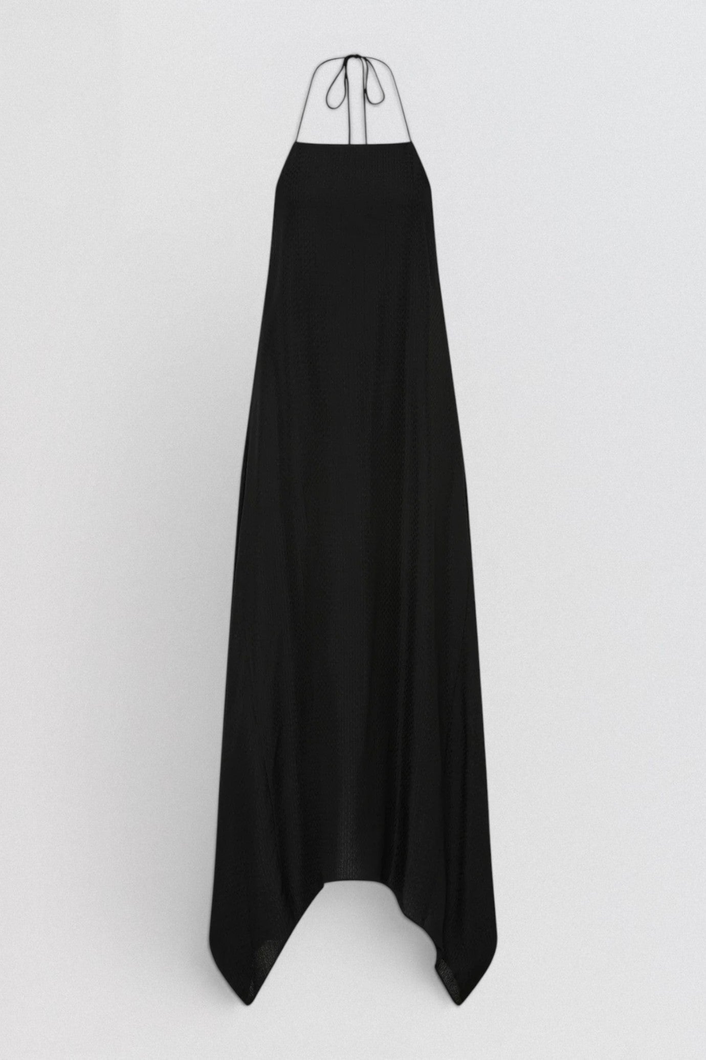 ST. AGNI Textured Weave Halter Dress in black with square halter neckline and asymmetric handkerchief hem